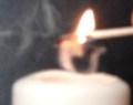 Re-igniting a candle by heating its 'smoke' 